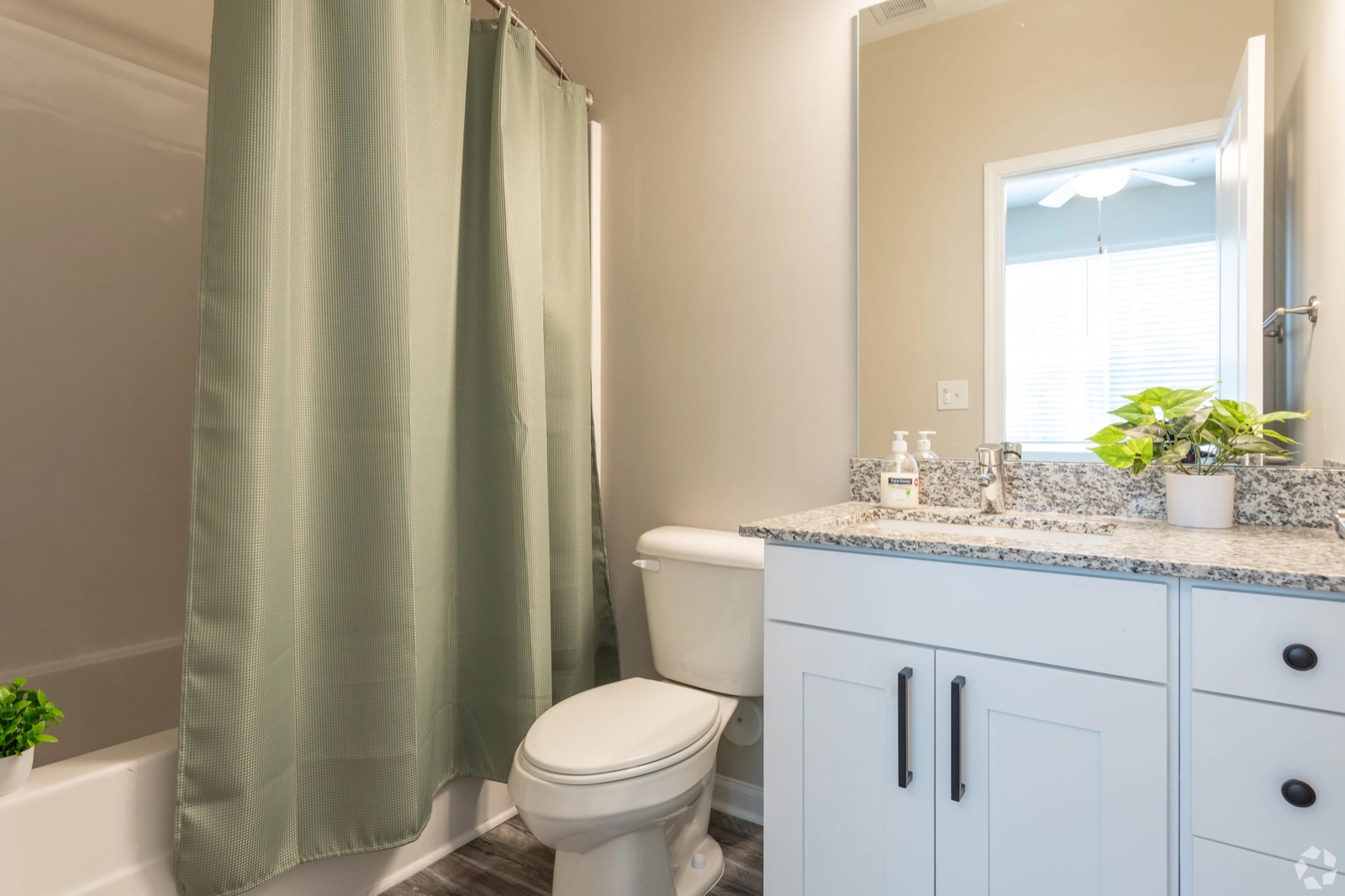 Bathroom with granite vanity and tub-shower