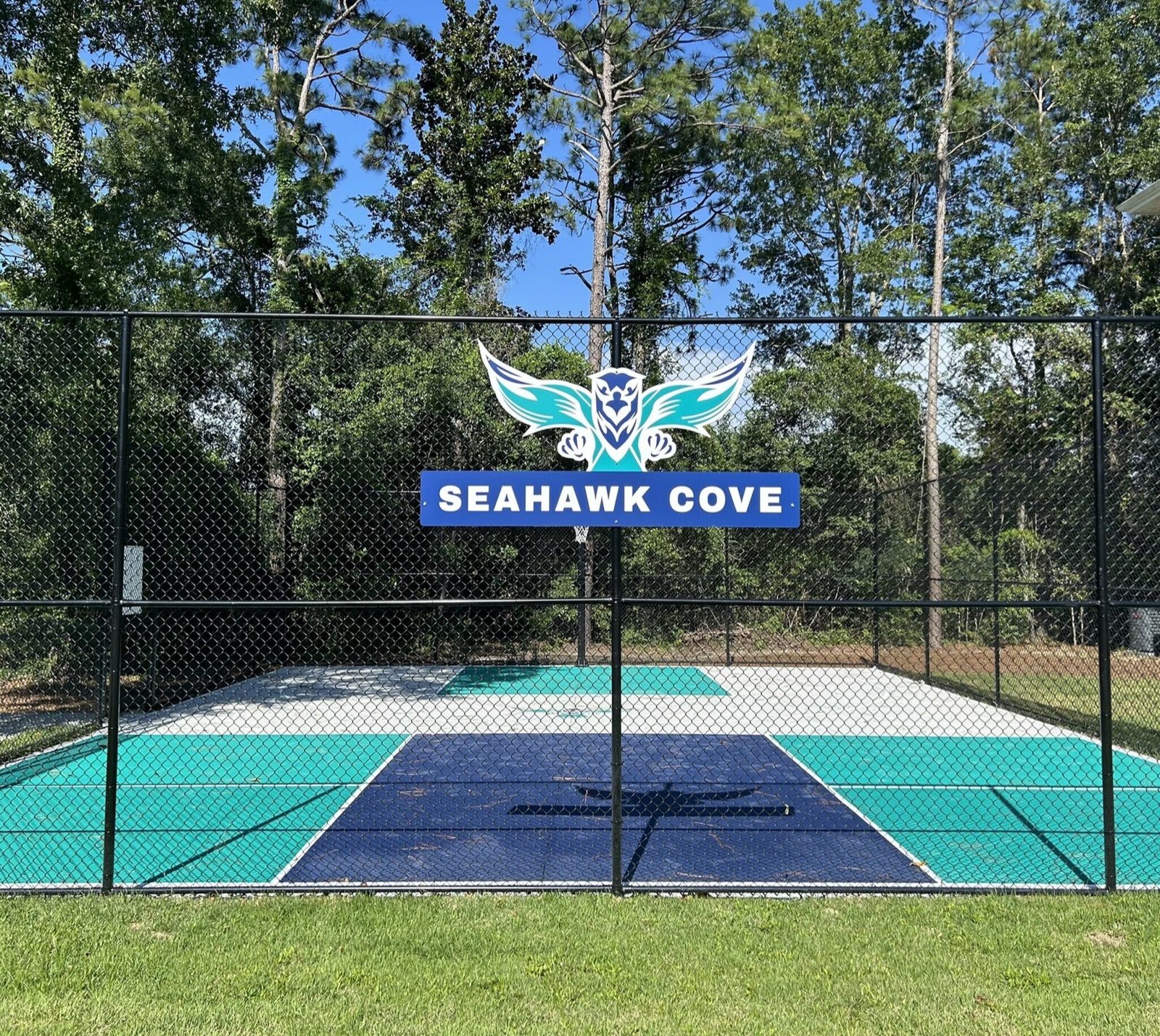 Outdoor sport court with Seahawk Cove logo